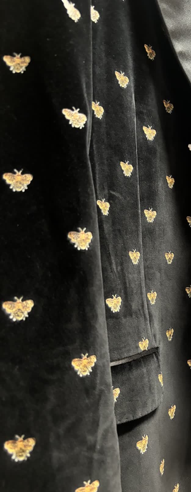 Sartorio black cotton jacquard with gold bees, fabric close-up