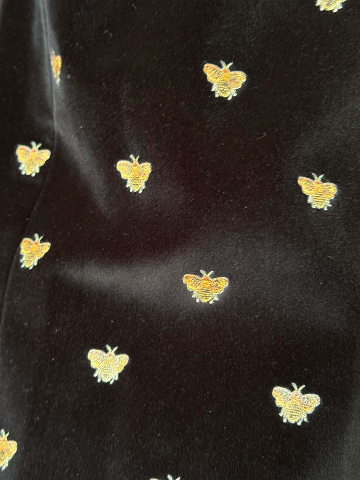 Sartorio black cotton velvet with gold bees, fabric macro