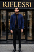 Sartorio Cashmere-Beaver Lined Bomber — Dark Blue worn open by the model in front of the Riflessi store