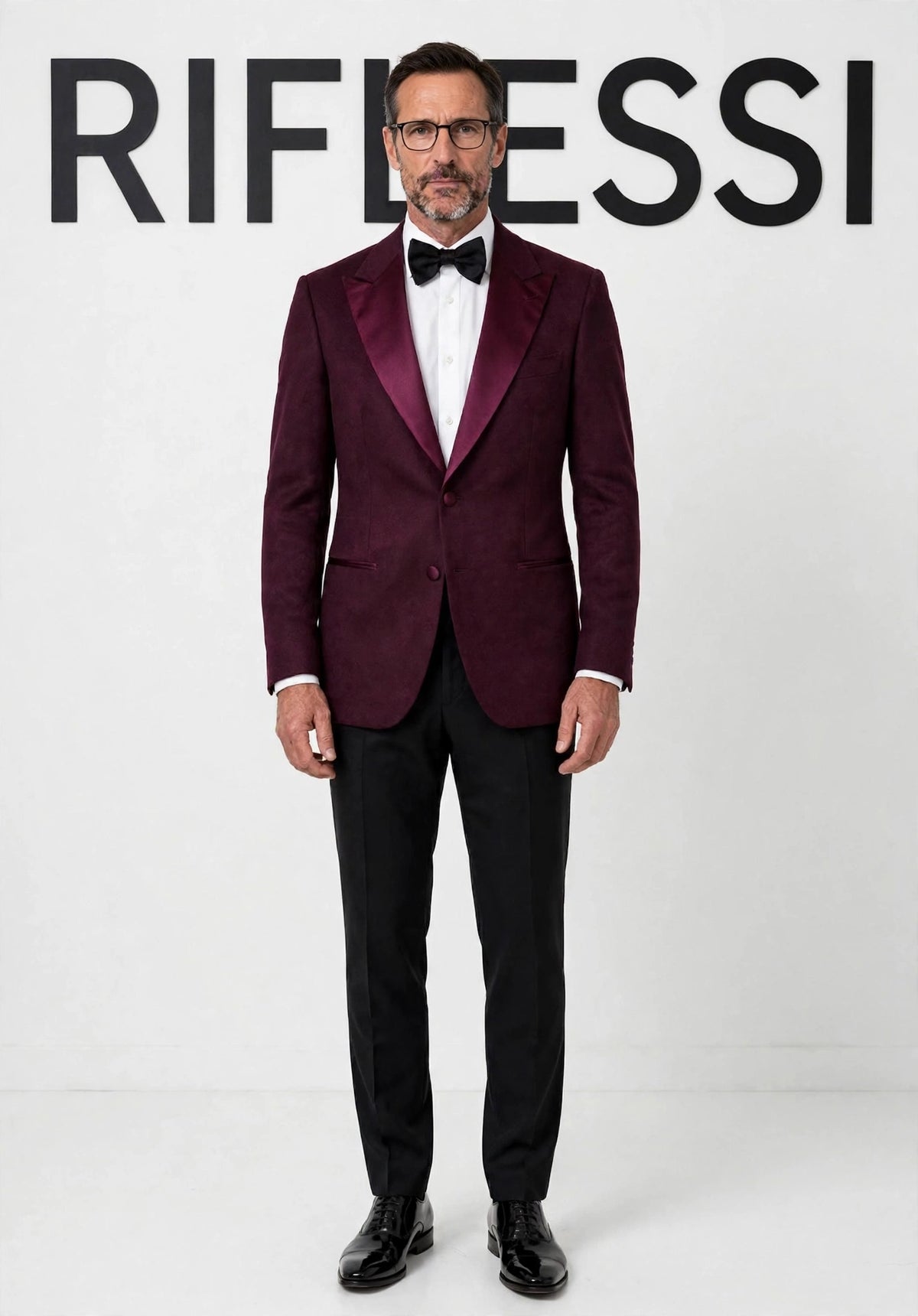 Sartorio burgundy cashmere tuxedo jacket on model, white backdrop