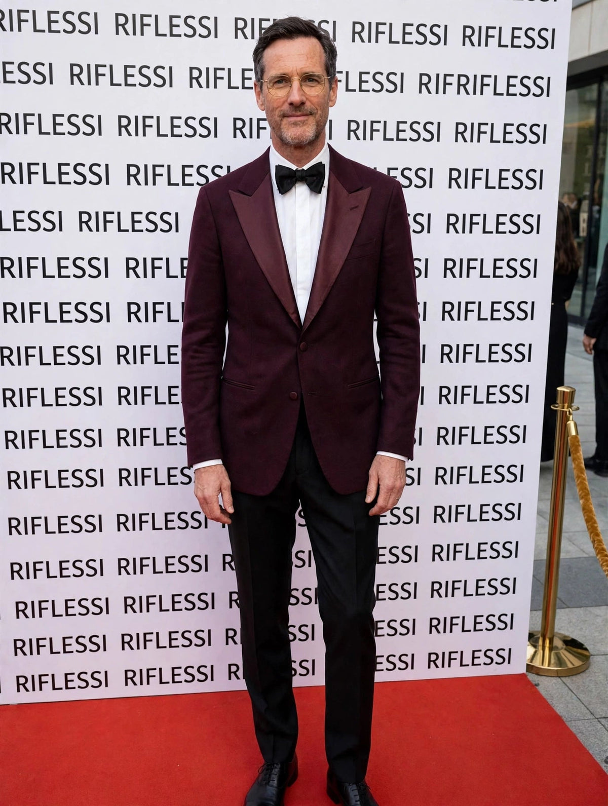 Sartorio burgundy cashmere tuxedo jacket on the model at the Riflessi wall