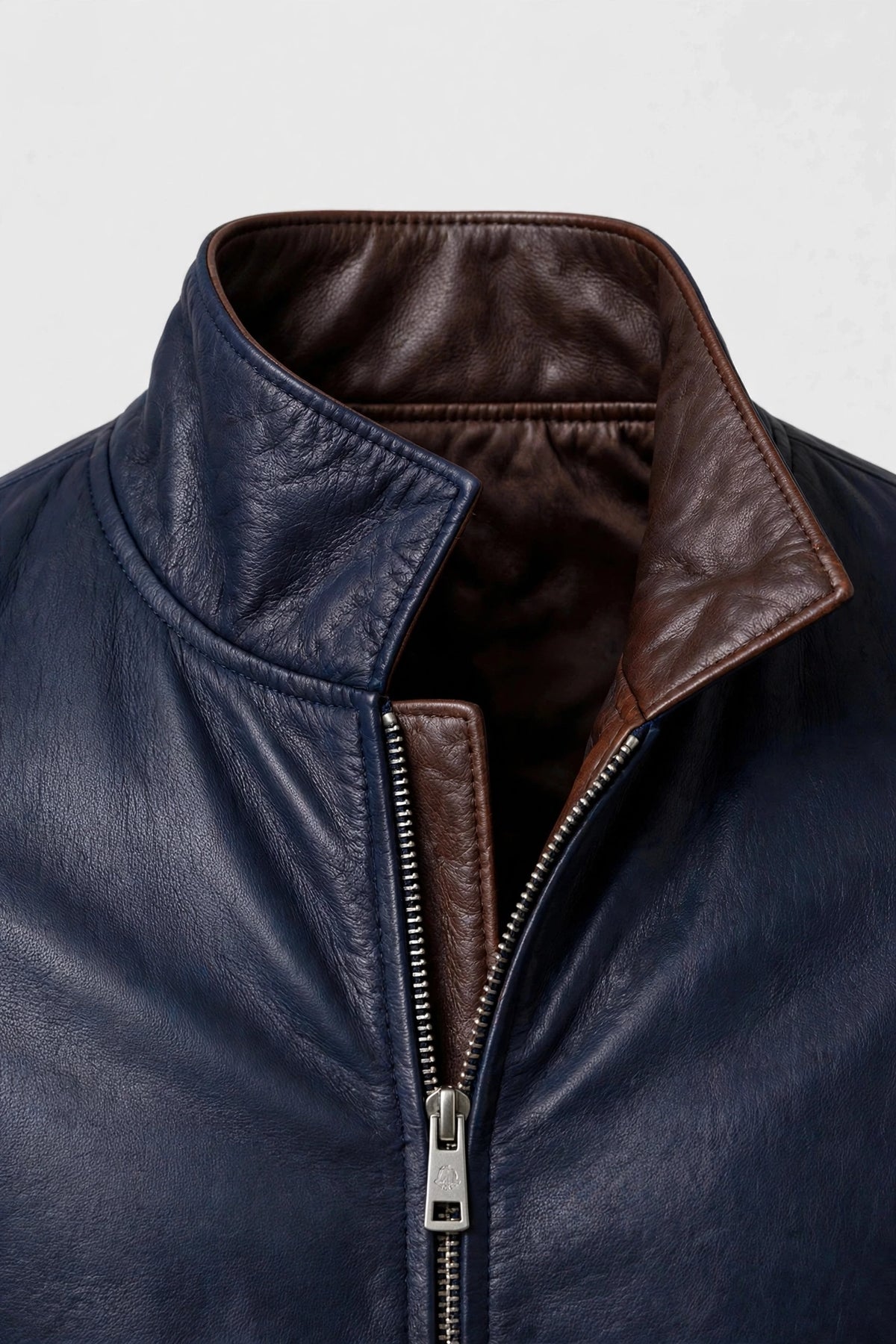 Kired PISA lambskin bomber — reversible collar, navy side with brown lambskin inside