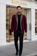 Sartorio Cashmere Blouson in Burgundy worn open by the model in front of the Riflessi store