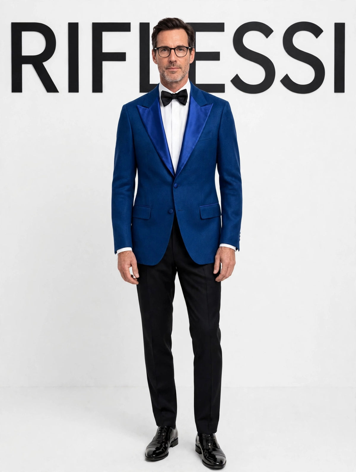 Sartorio royal blue cashmere tuxedo jacket on model, white backdrop